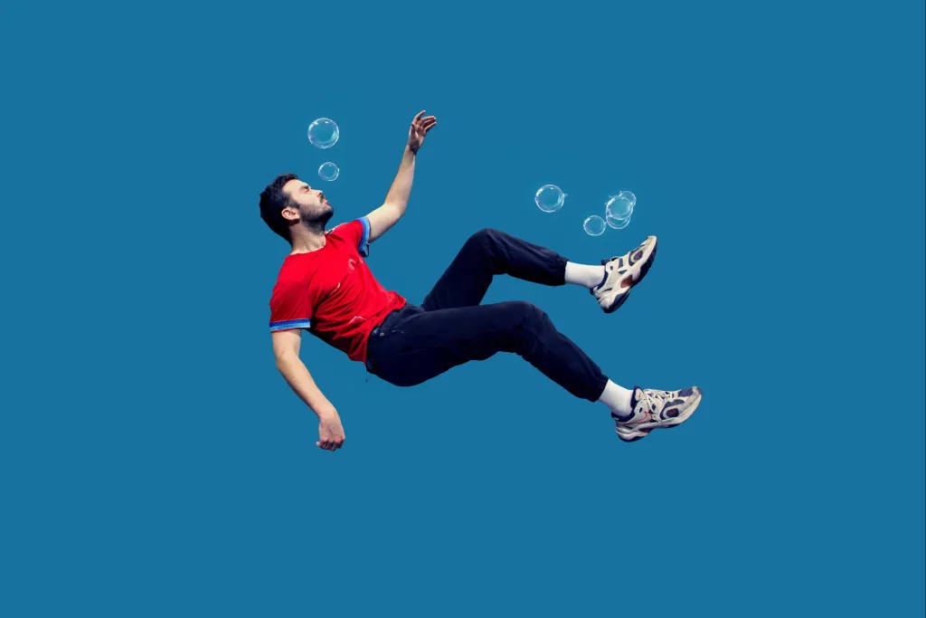 Homme entouré de bulles sur fonds bleu
